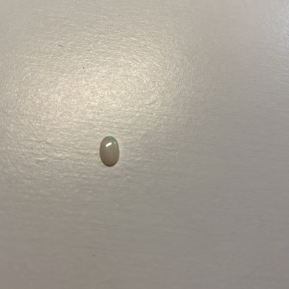 3 Opals And One Tanzanite Oval Gems View 4